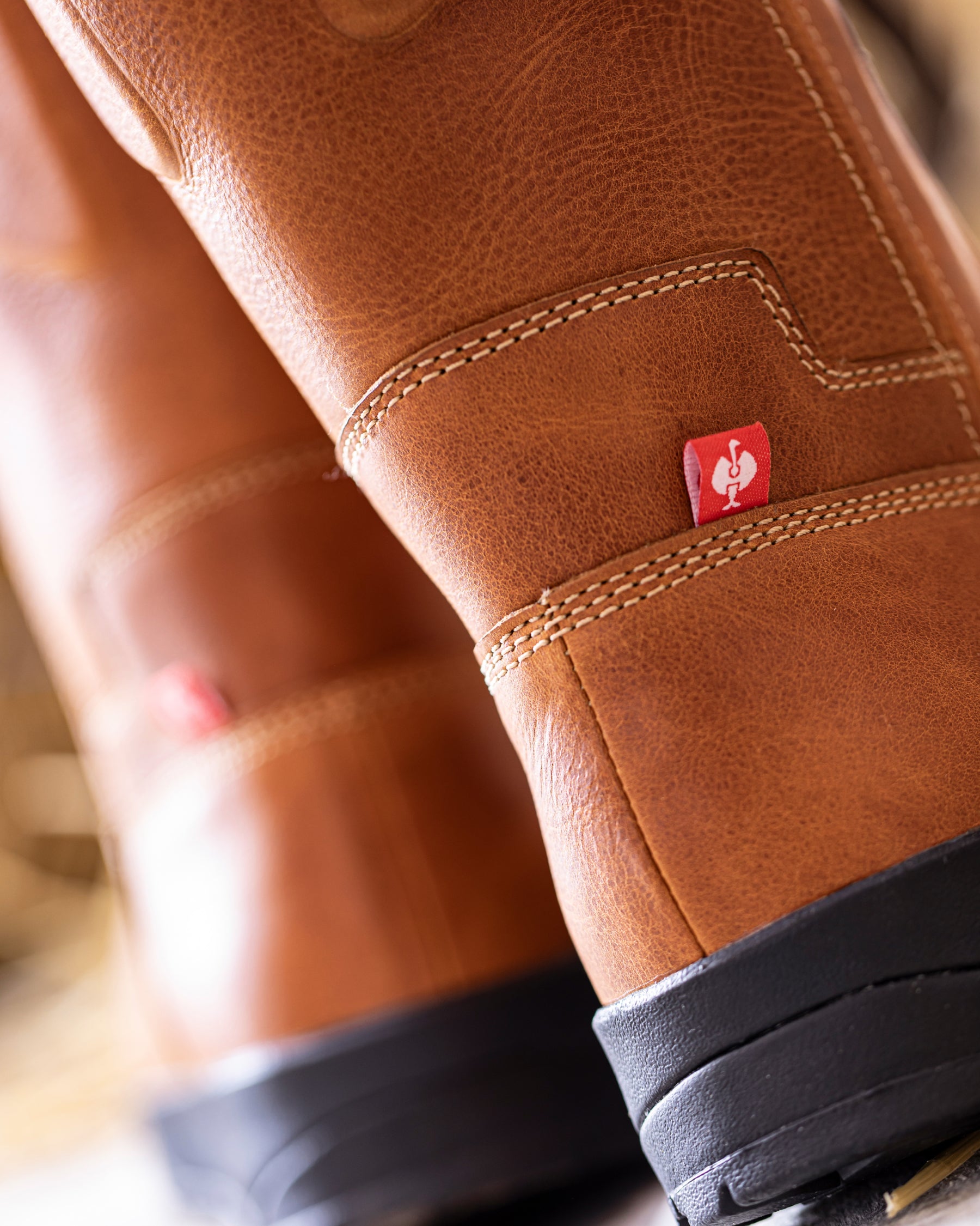 STRAUSS Kingston 11-inch Steel Toe Work Boot in Light brown worn in an outdoor work setting