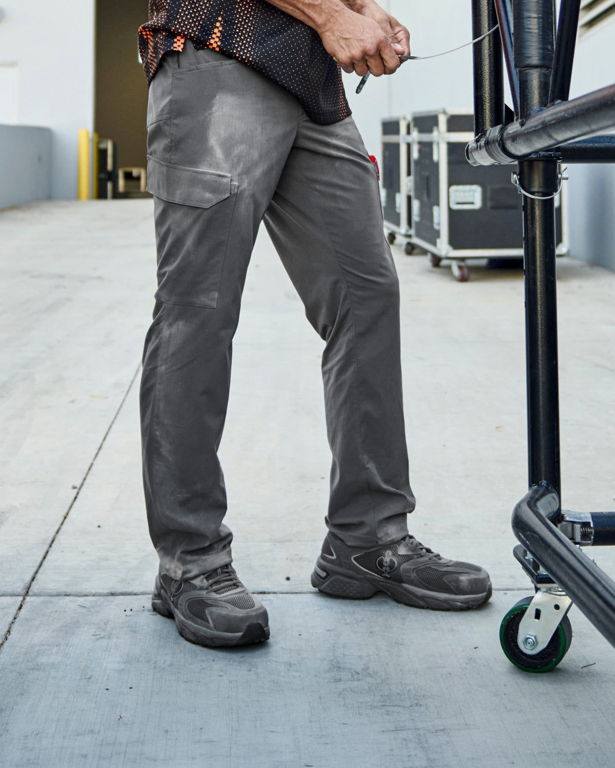 STRAUSS St. Louis Composite Toe Work Shoe in Carbon gray worn in an outdoor work setting