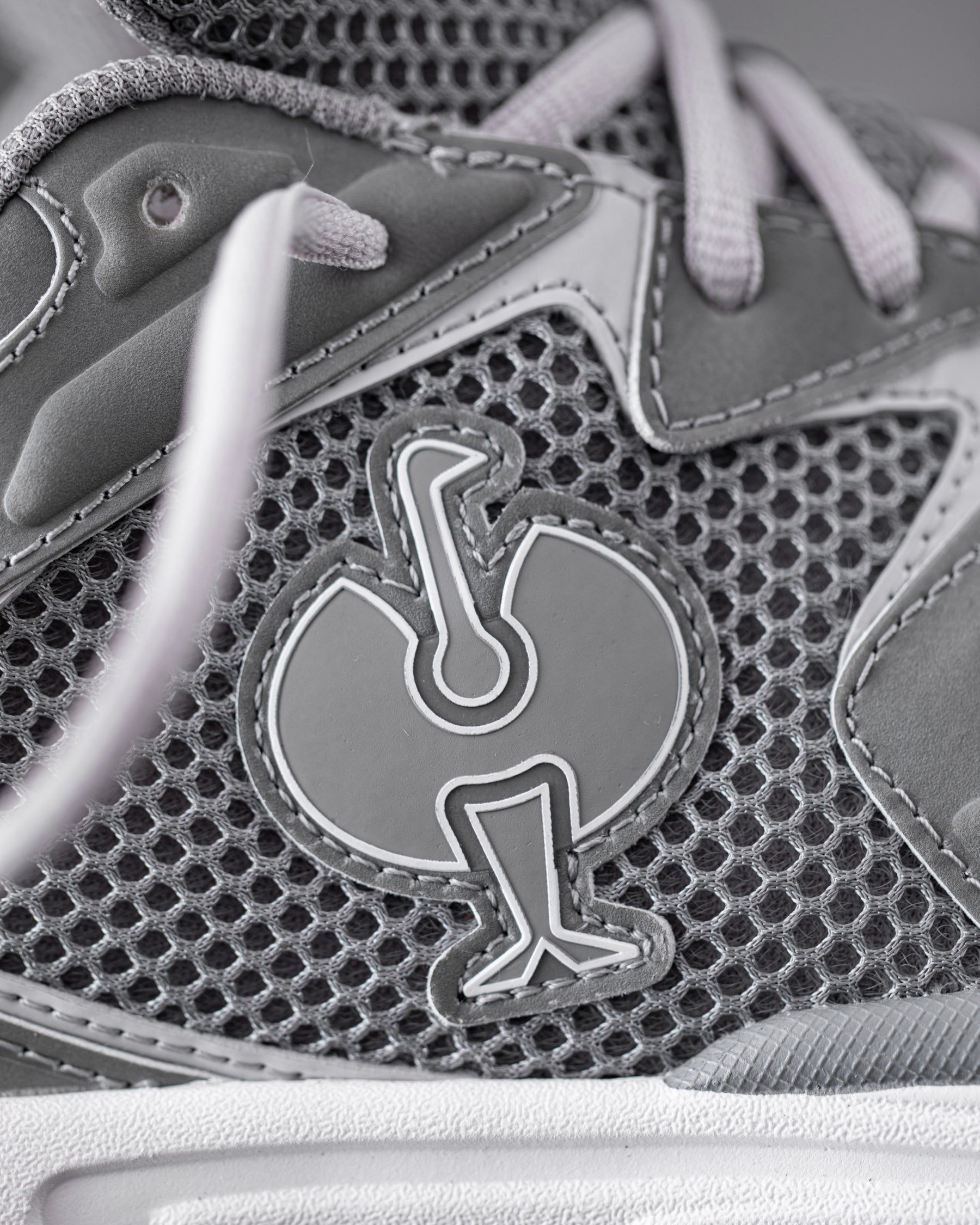 Close-up of the Pearl gray St. Louis Composite Toe Work Shoe Strauss Logo