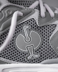 Close-up of the Pearl gray St. Louis Composite Toe Work Shoe Strauss Logo
