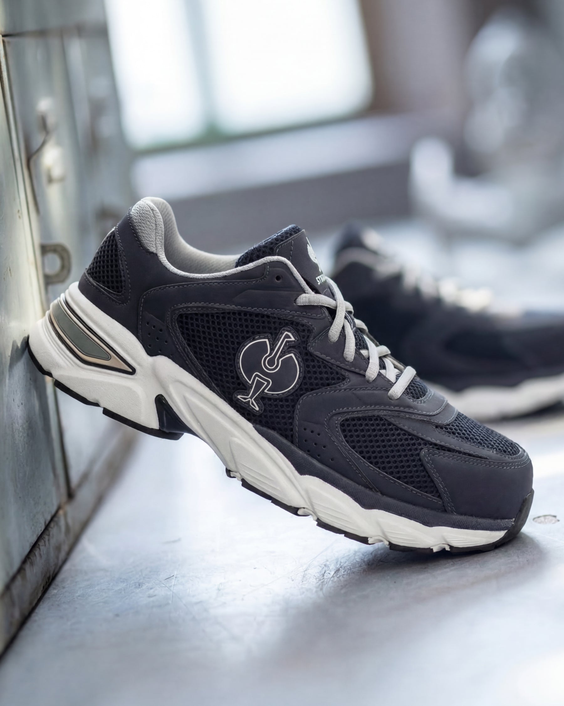 STRAUSS St. Louis Composite Toe Work Shoe in Nero blue with workwear in a jobsite scene