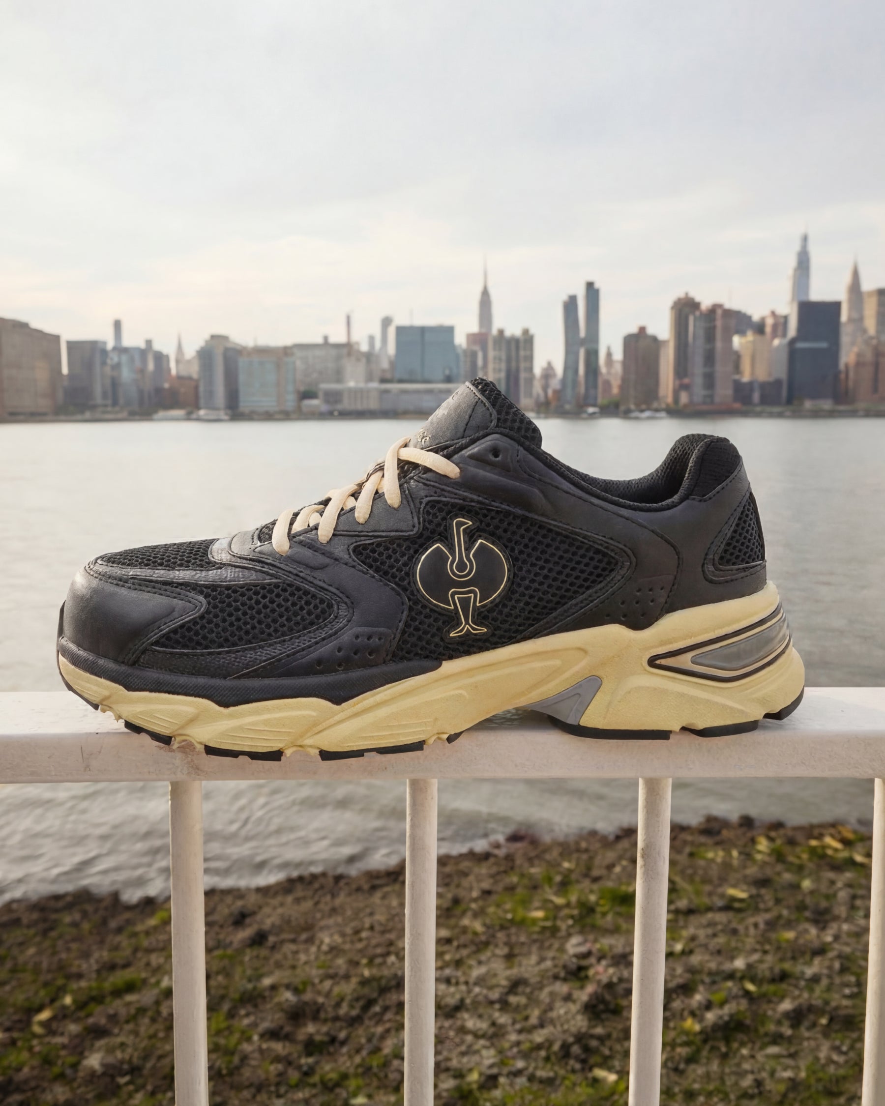 STRAUSS St. Louis Composite Toe Work Shoe in Black and Sand worn in an outdoor work setting