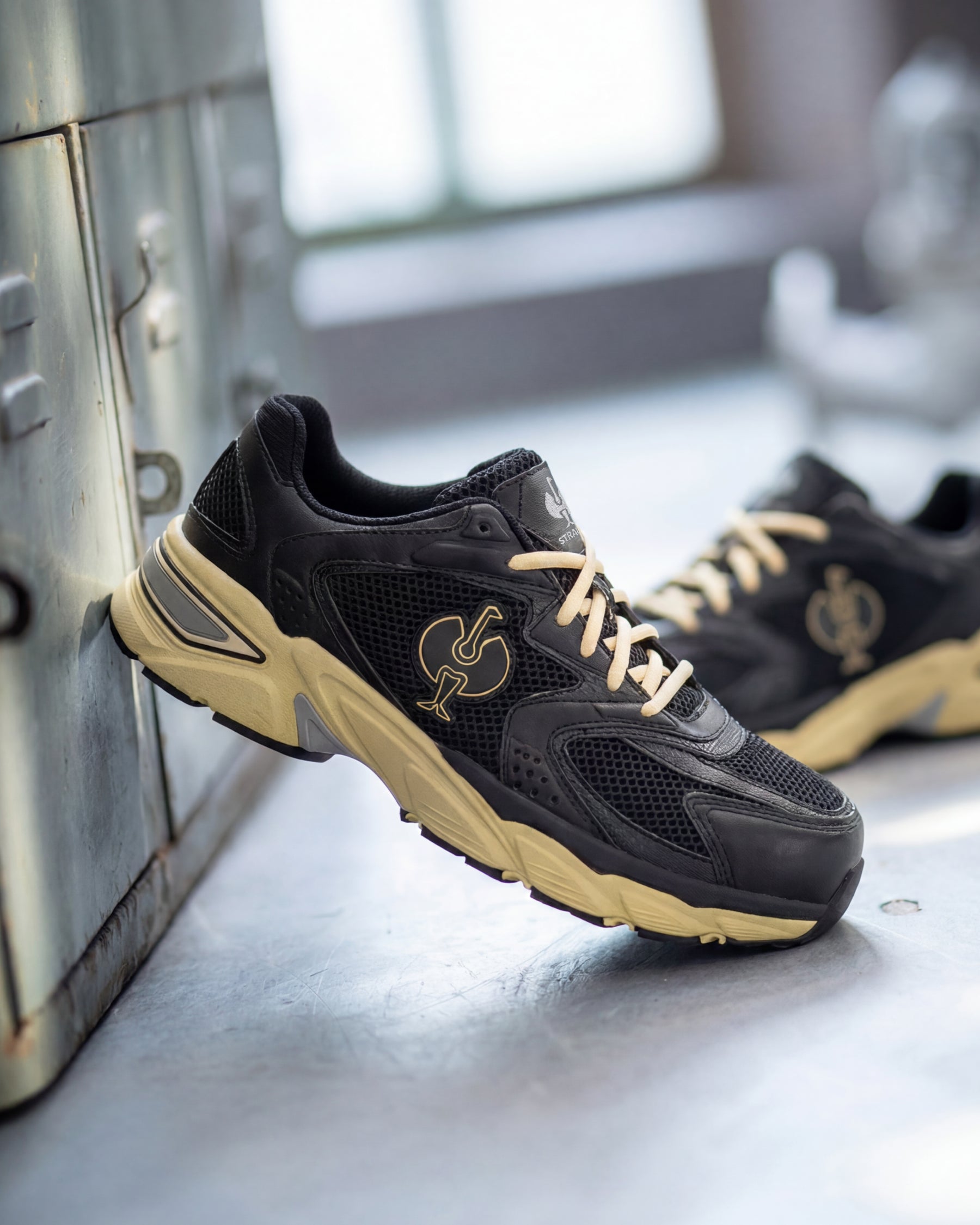 STRAUSS St. Louis Composite Toe Work Shoe in Black and Sand with workwear in a jobsite scene