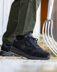 STRAUSS Canberra Steel Toe Work Shoe in Black shown on rough jobsite ground
