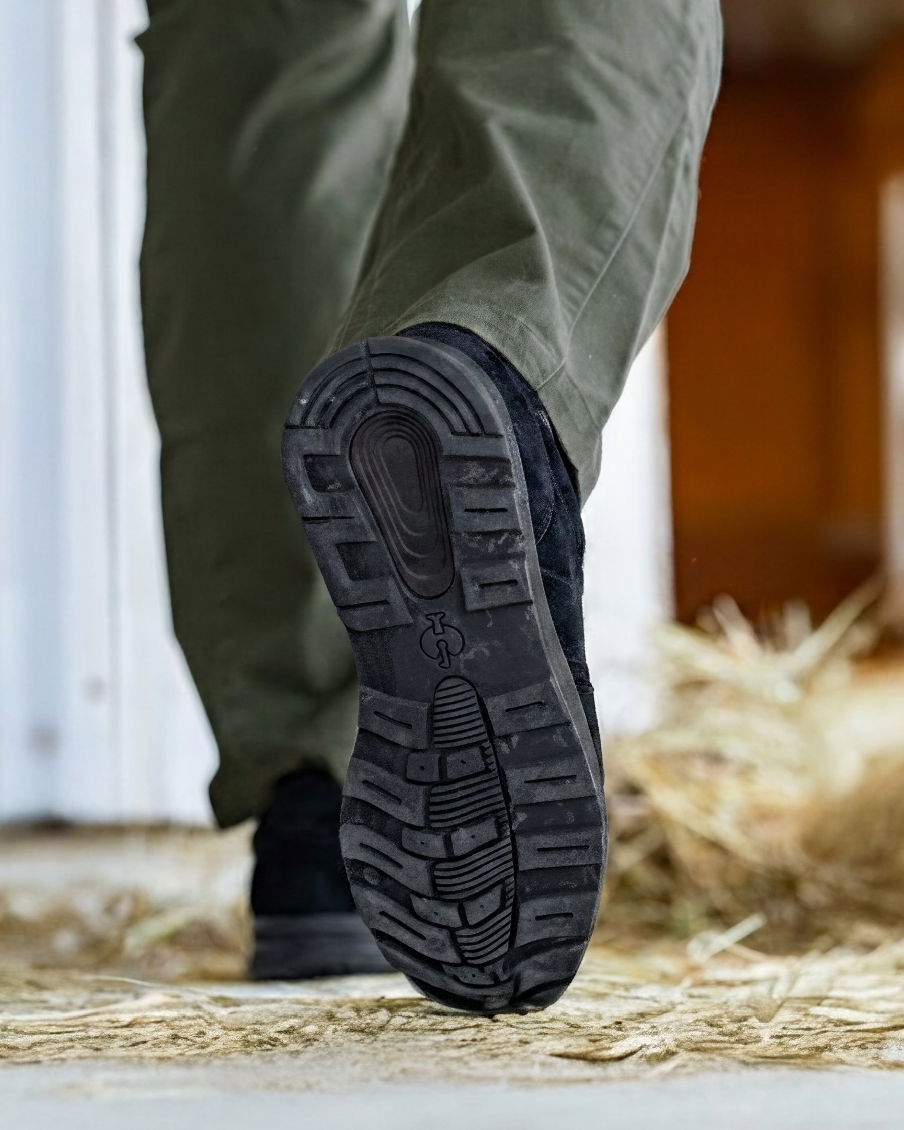STRAUSS Canberra Steel Toe Work Shoe in Black worn in an outdoor work setting