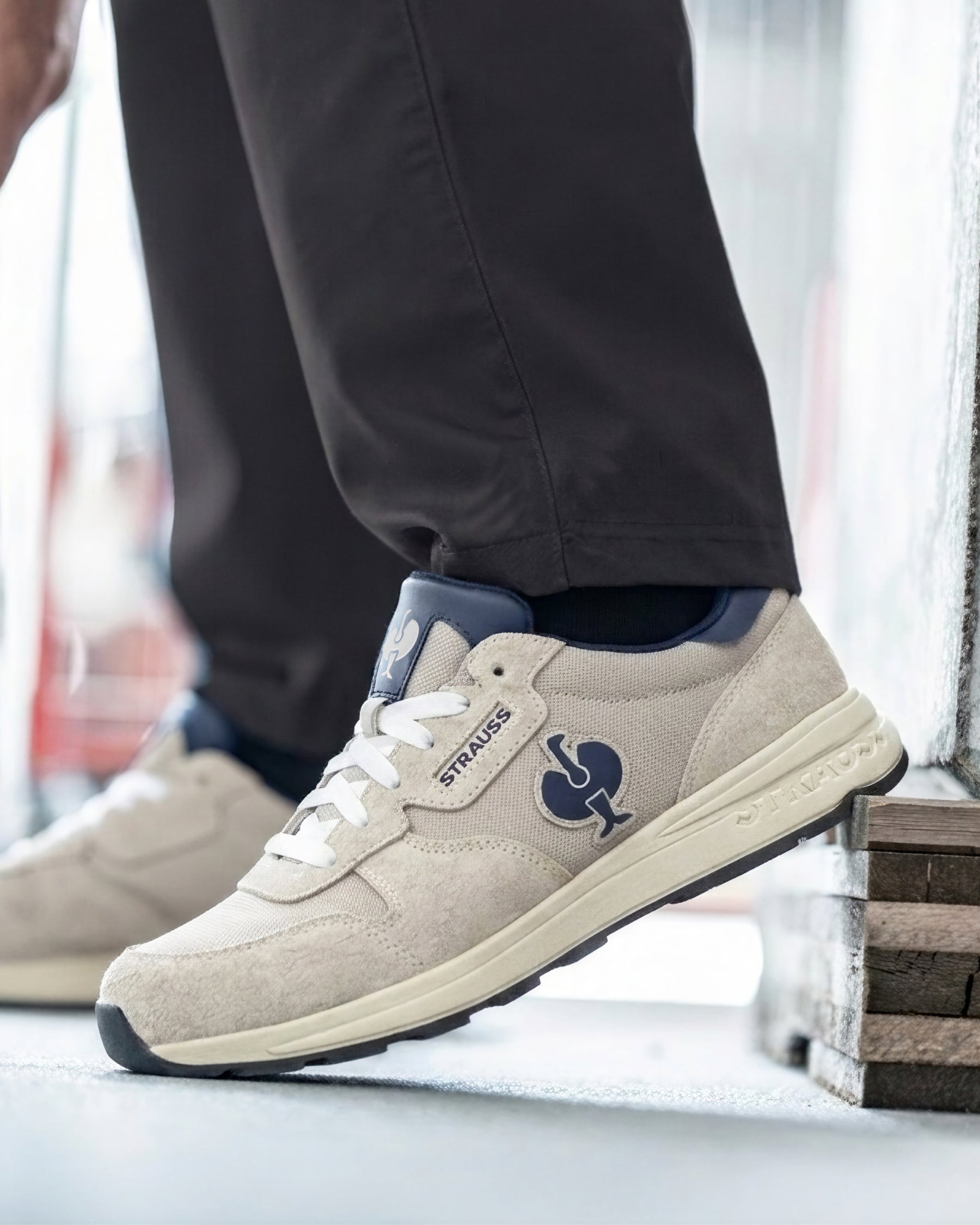 STRAUSS Canberra Steel Toe Work Shoe in Silver worn in an outdoor work setting
