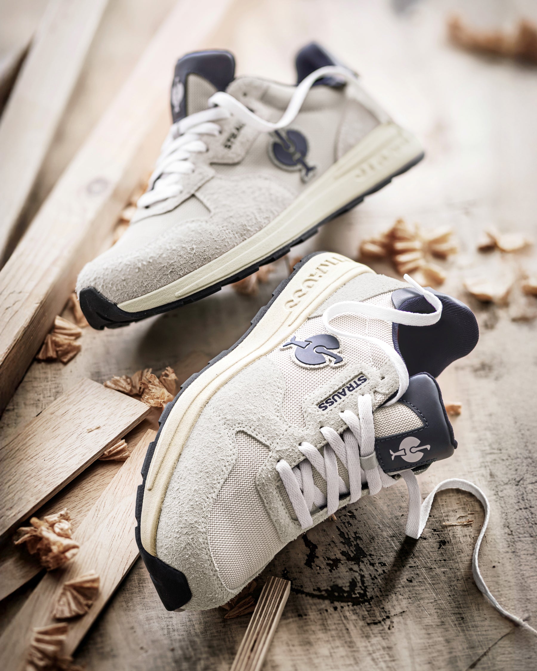 STRAUSS Canberra Steel Toe Work Shoe in Silver with workwear in a jobsite scene