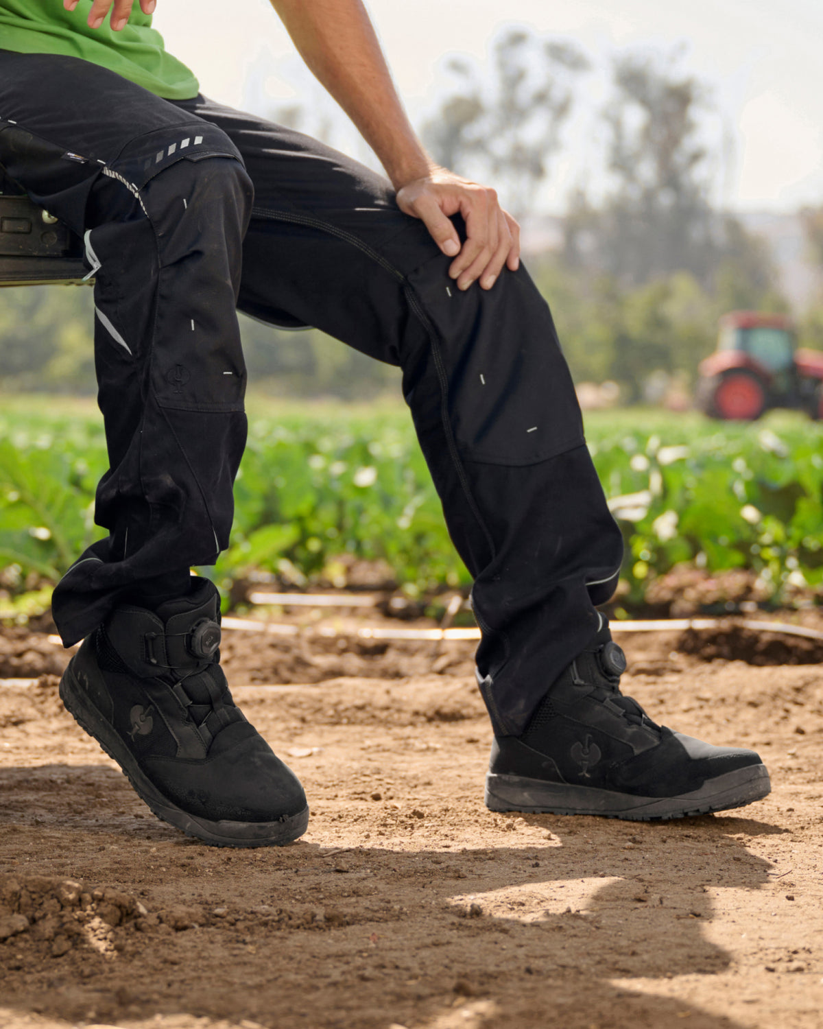 STRAUSS Murcia 6-inch Steel Toe Work Boot in Black shown on rough jobsite ground