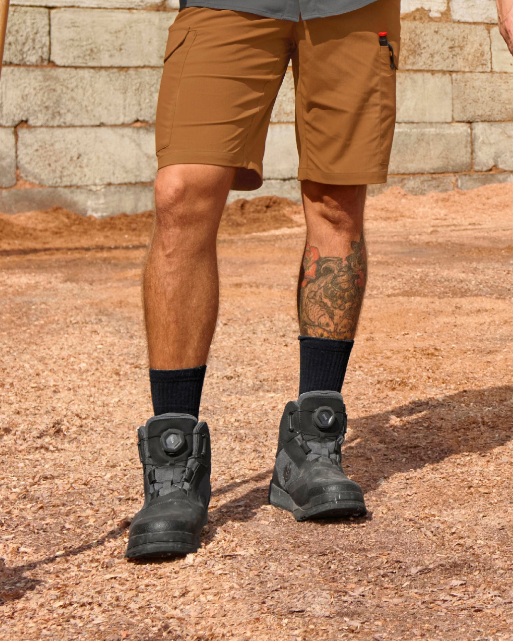 STRAUSS Murcia 6-inch Steel Toe Work Boot in Carbon gray and Black shown on rough jobsite ground