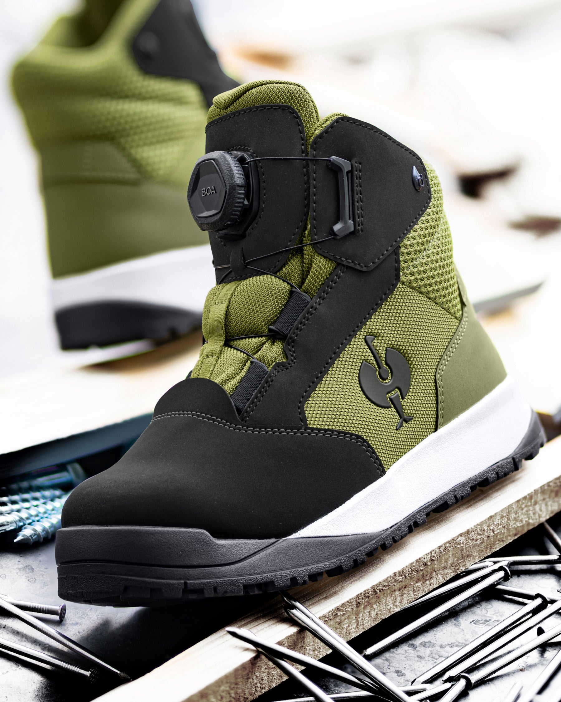 STRAUSS Murcia 6-inch Steel Toe Work Boot in Black and Mountain green shown in use on the job