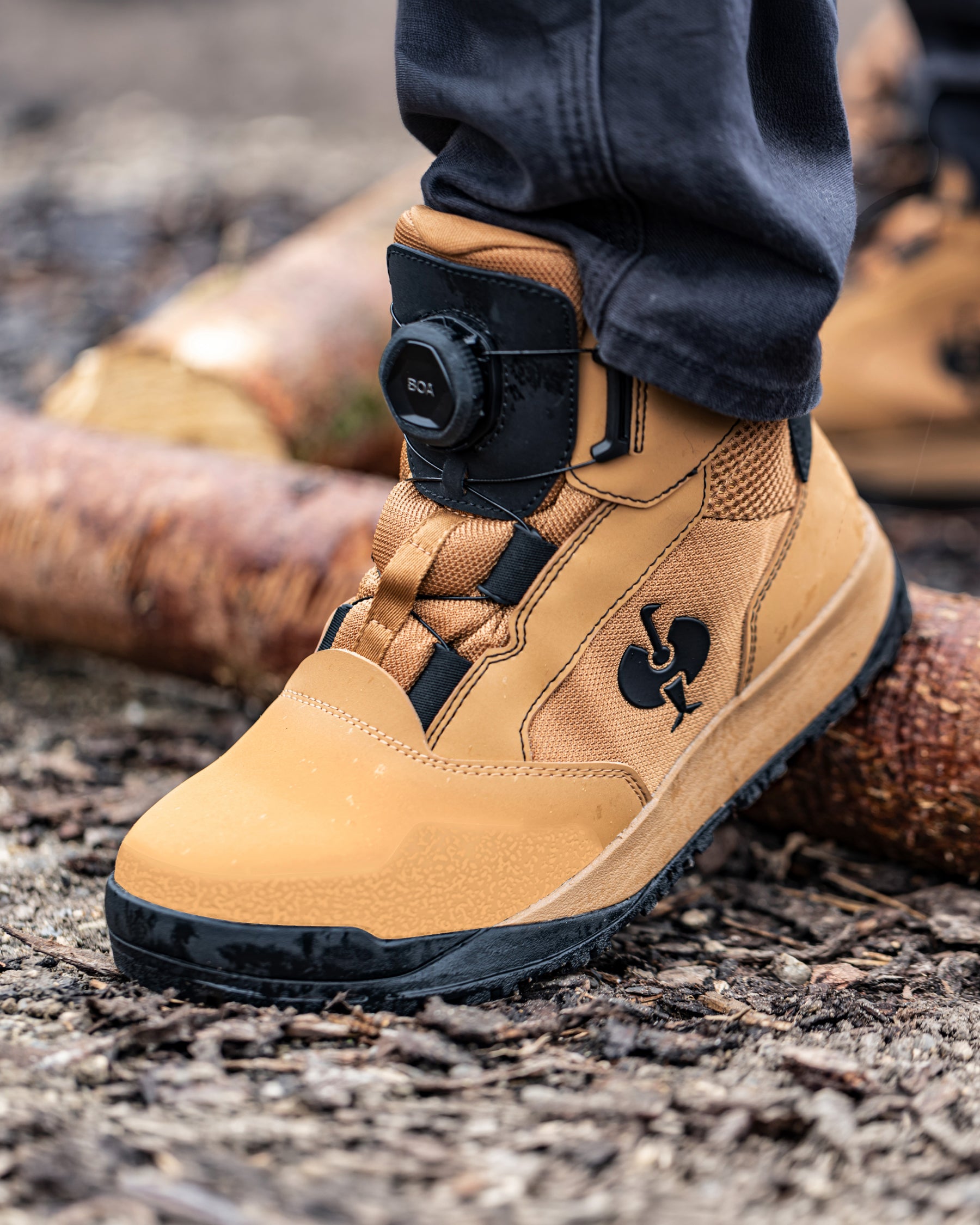 STRAUSS Murcia 6-inch Steel Toe Work Boot in Almond brown and Black shown on rough jobsite ground