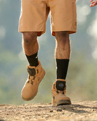 STRAUSS Murcia 6-inch Steel Toe Work Boot in Almond brown and Black worn in an outdoor work setting