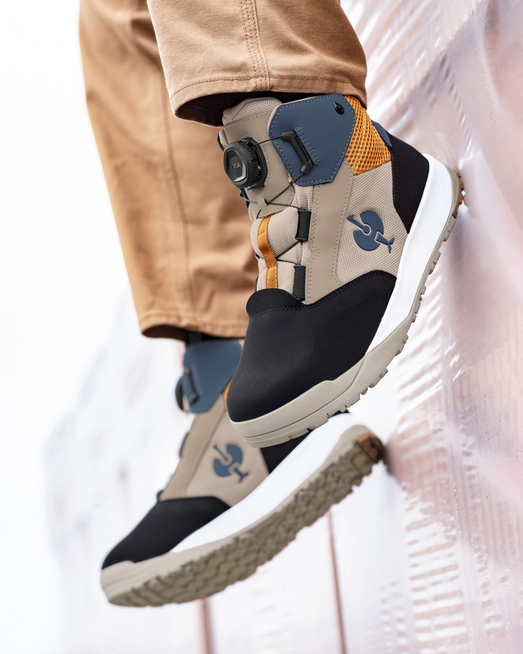 STRAUSS Murcia 6-inch Steel Toe Work Boot in Black, Dolphin gray, and Almond brown with workwear in a jobsite scene