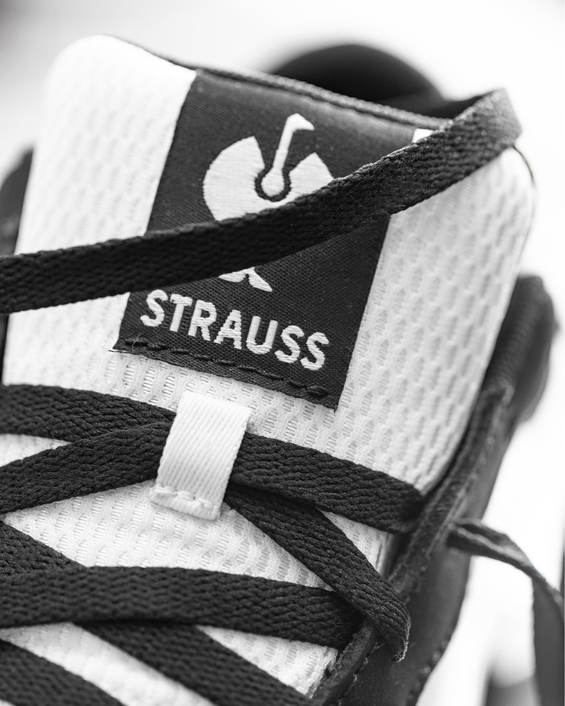 STRAUSS Eindhoven Steel Toe Work Shoe in Black and White shown in use on the job