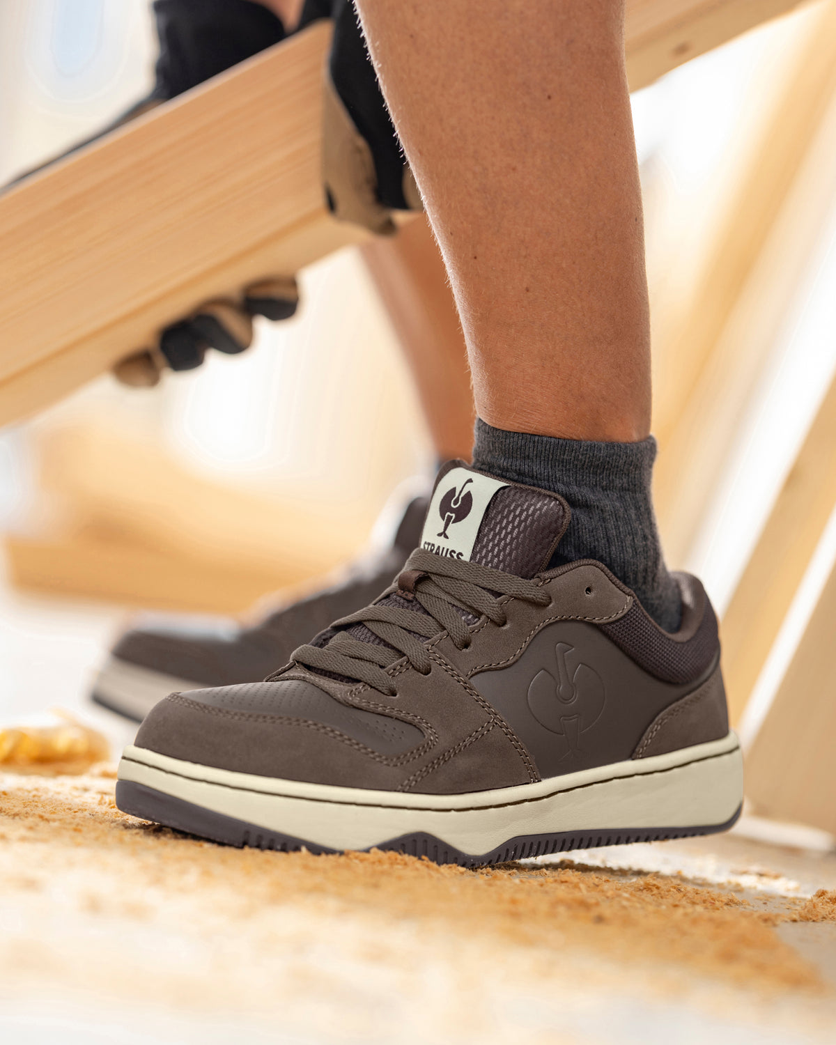 STRAUSS Eindhoven Steel Toe Work Shoe in Chestnut shown on rough jobsite ground