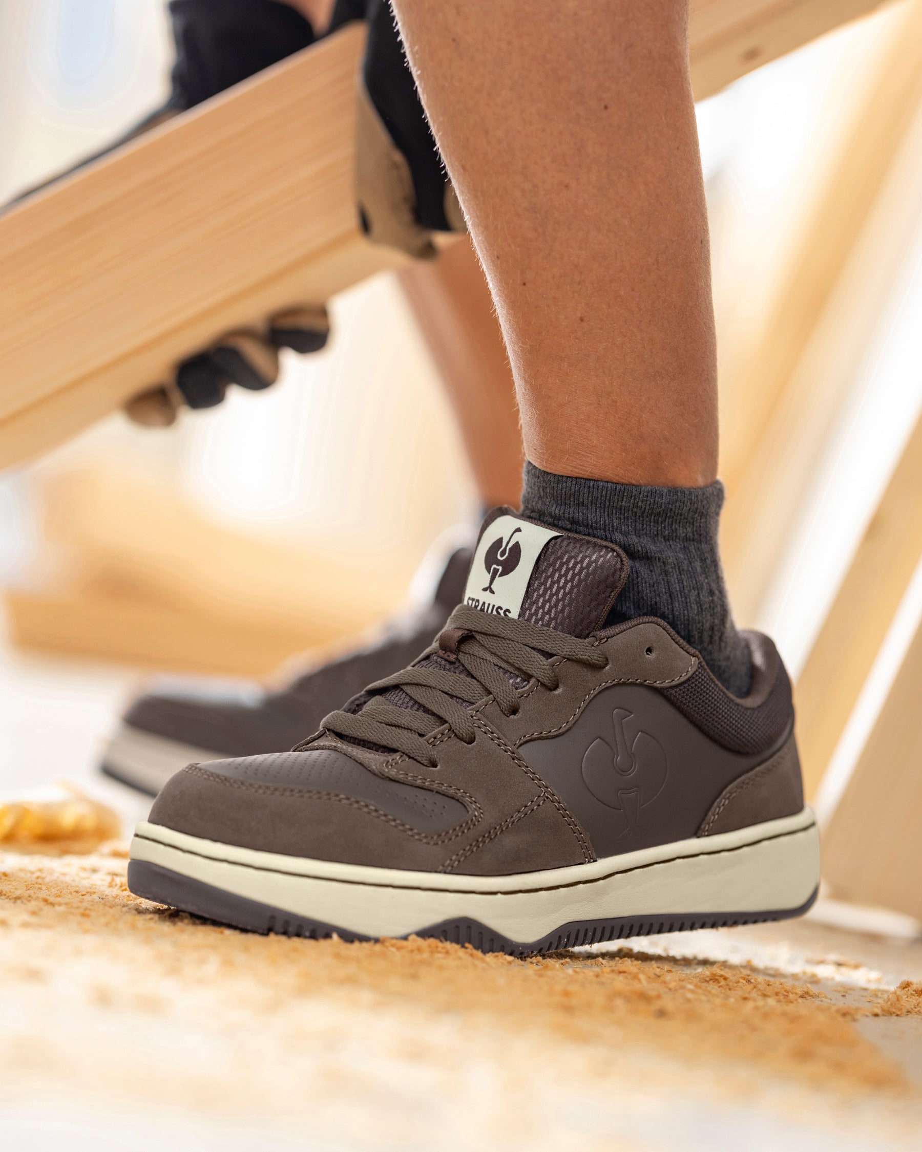 STRAUSS Eindhoven Steel Toe Work Shoe in Chestnut shown on rough jobsite ground