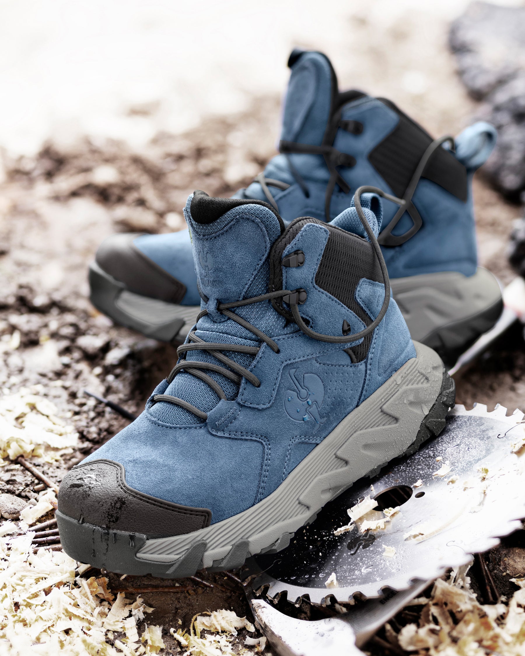 STRAUSS Turin 6-inch Aluminum Toe Work Boot in Oxid blue worn in an outdoor work setting