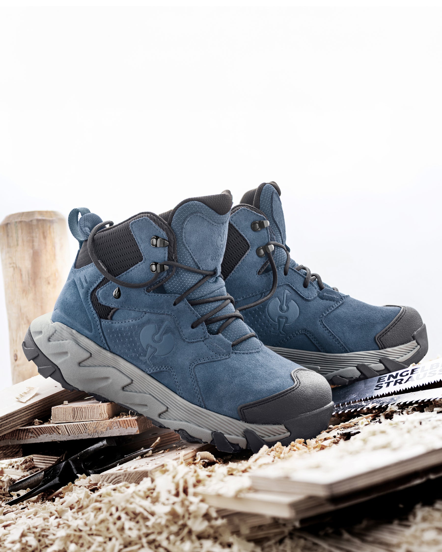 STRAUSS Turin 6-inch Aluminum Toe Work Boot in Oxid blue with workwear in a jobsite scene
