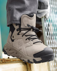 STRAUSS Turin 6-inch Aluminum Toe Work Boot in Dolphin gray worn in an outdoor work setting