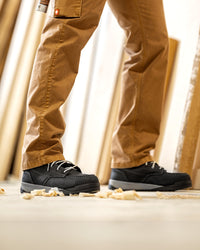 STRAUSS Omaha 6-inch Steel Toe Work Boot in Black shown on rough jobsite ground