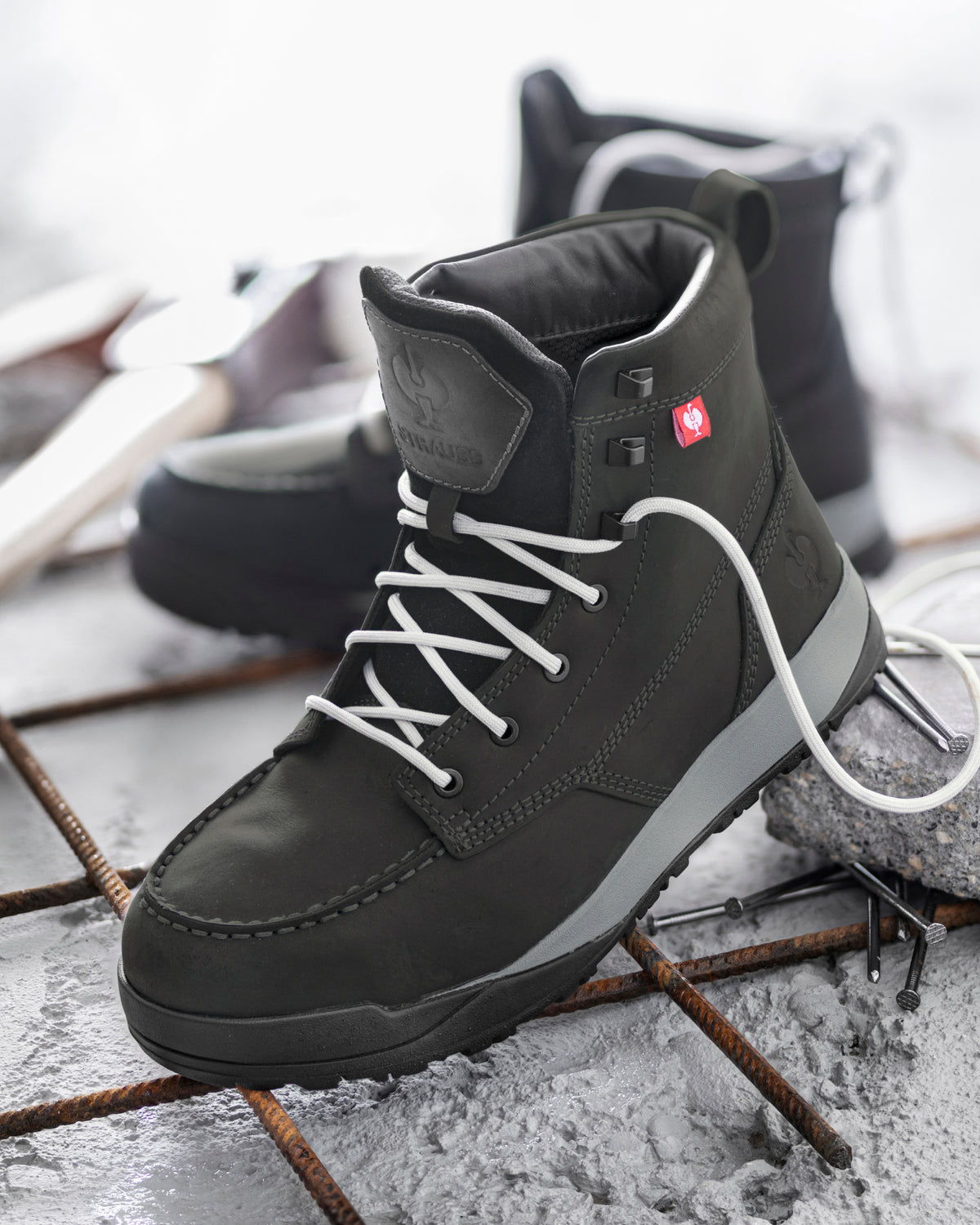 STRAUSS Omaha 6-inch Steel Toe Work Boot in Black with workwear in a jobsite scene