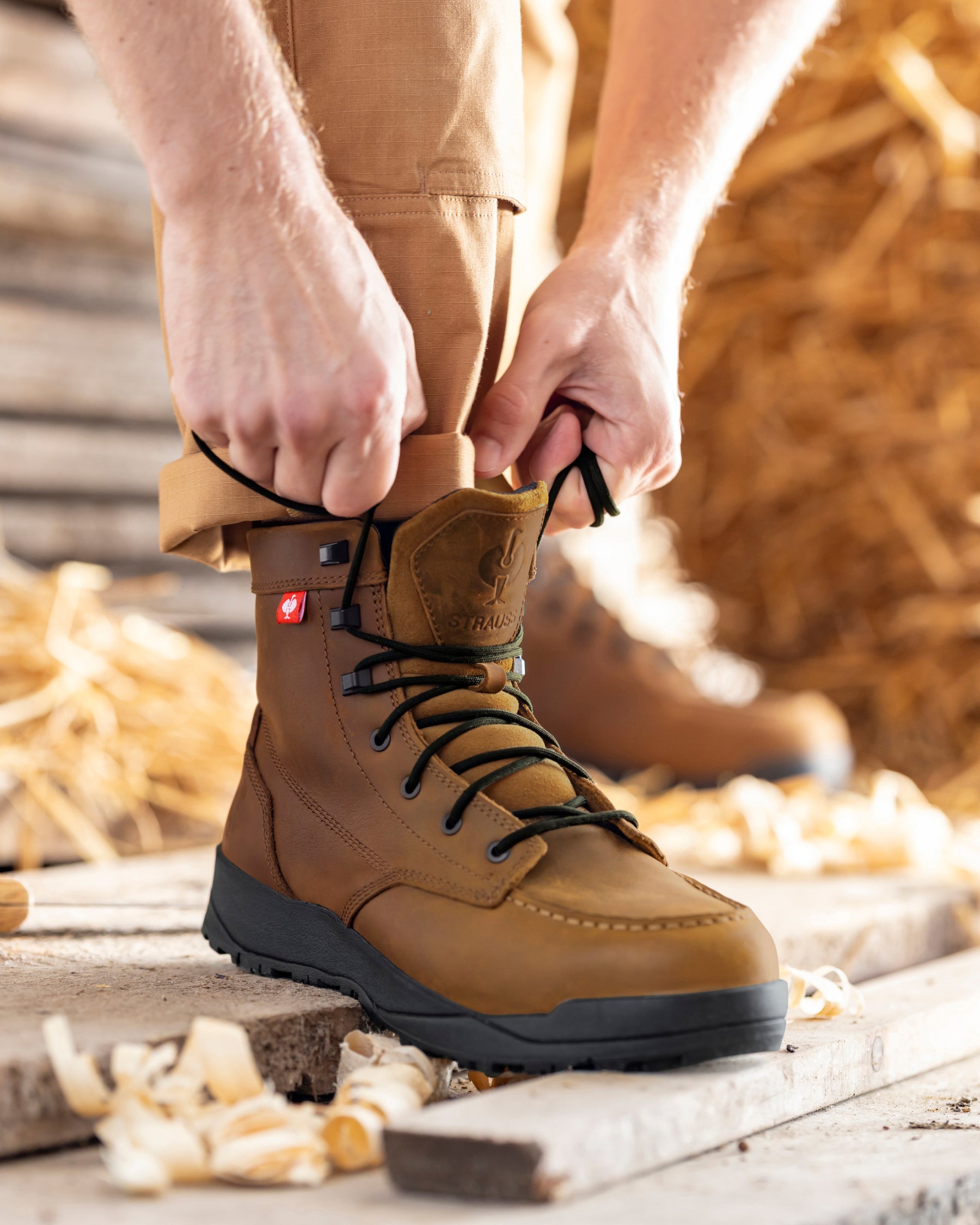STRAUSS Omaha 6-inch Steel Toe Work Boot in Carob brown shown on rough jobsite ground