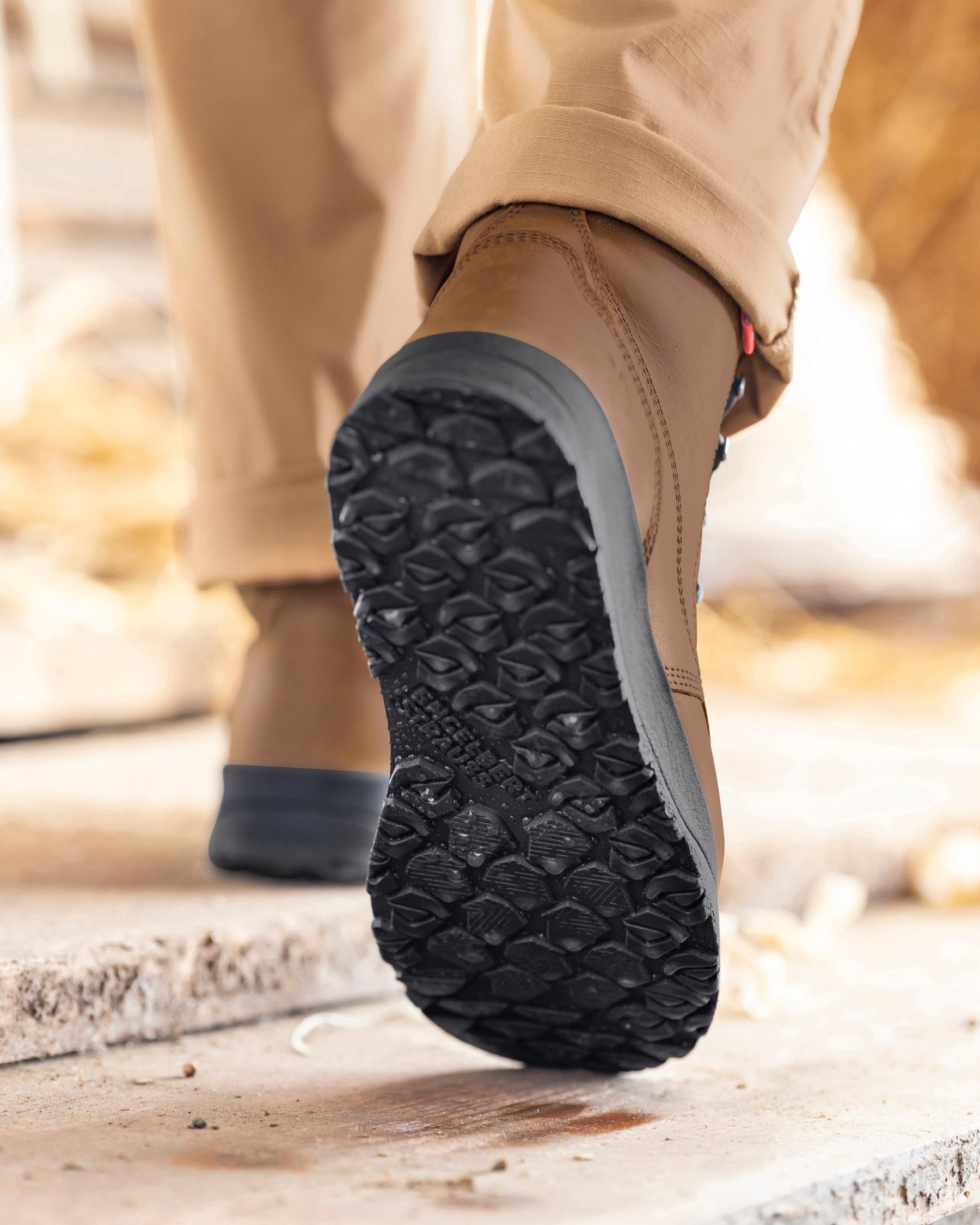 STRAUSS Omaha 6-inch Steel Toe Work Boot in Carob brown worn in an outdoor work setting