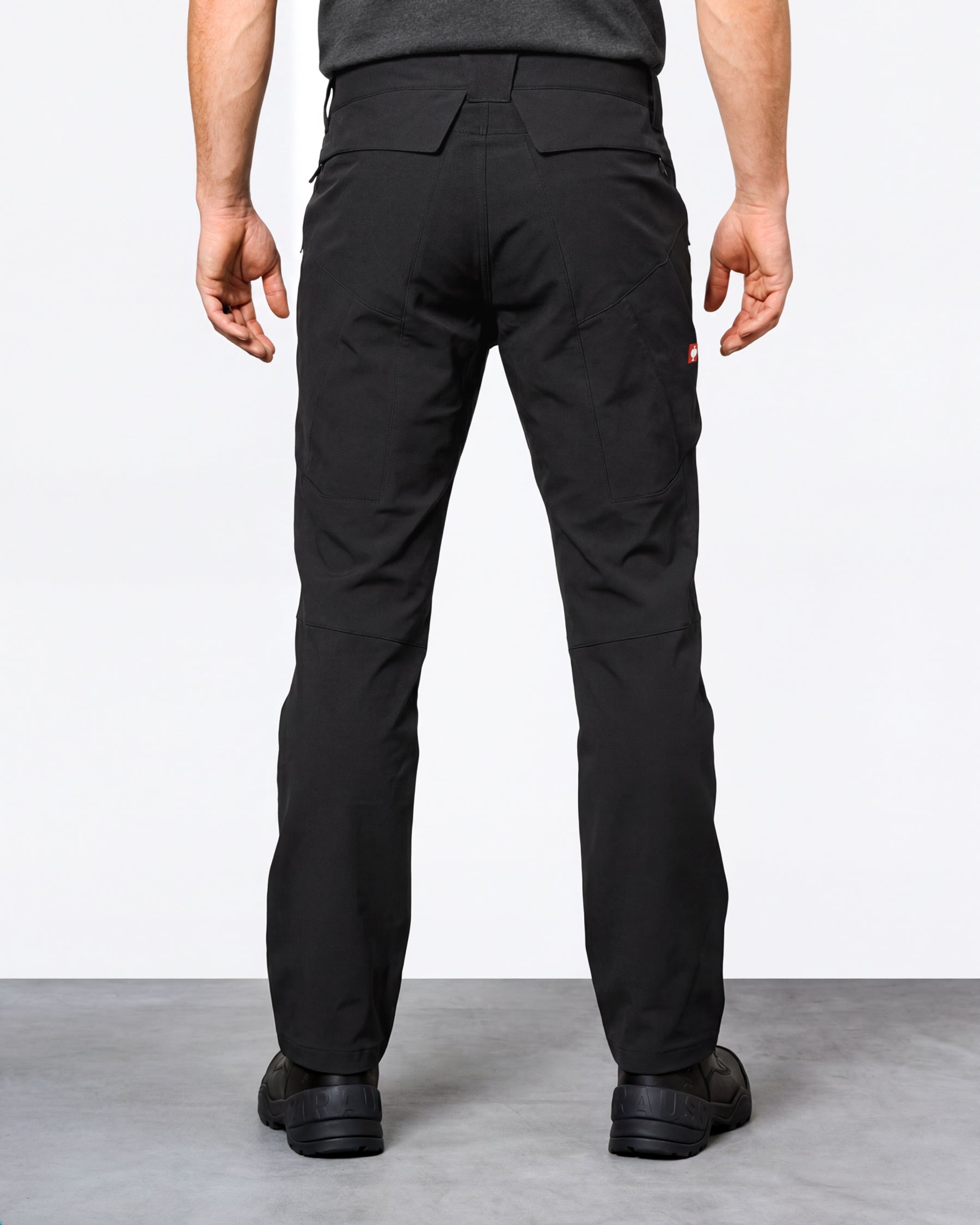 Utility Cargo Work Pants in black worn by a model, rear view