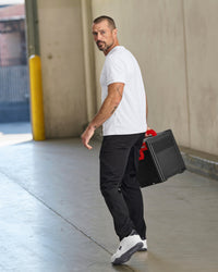 Lifestyle view of Utility Cargo Work Pants in black during work