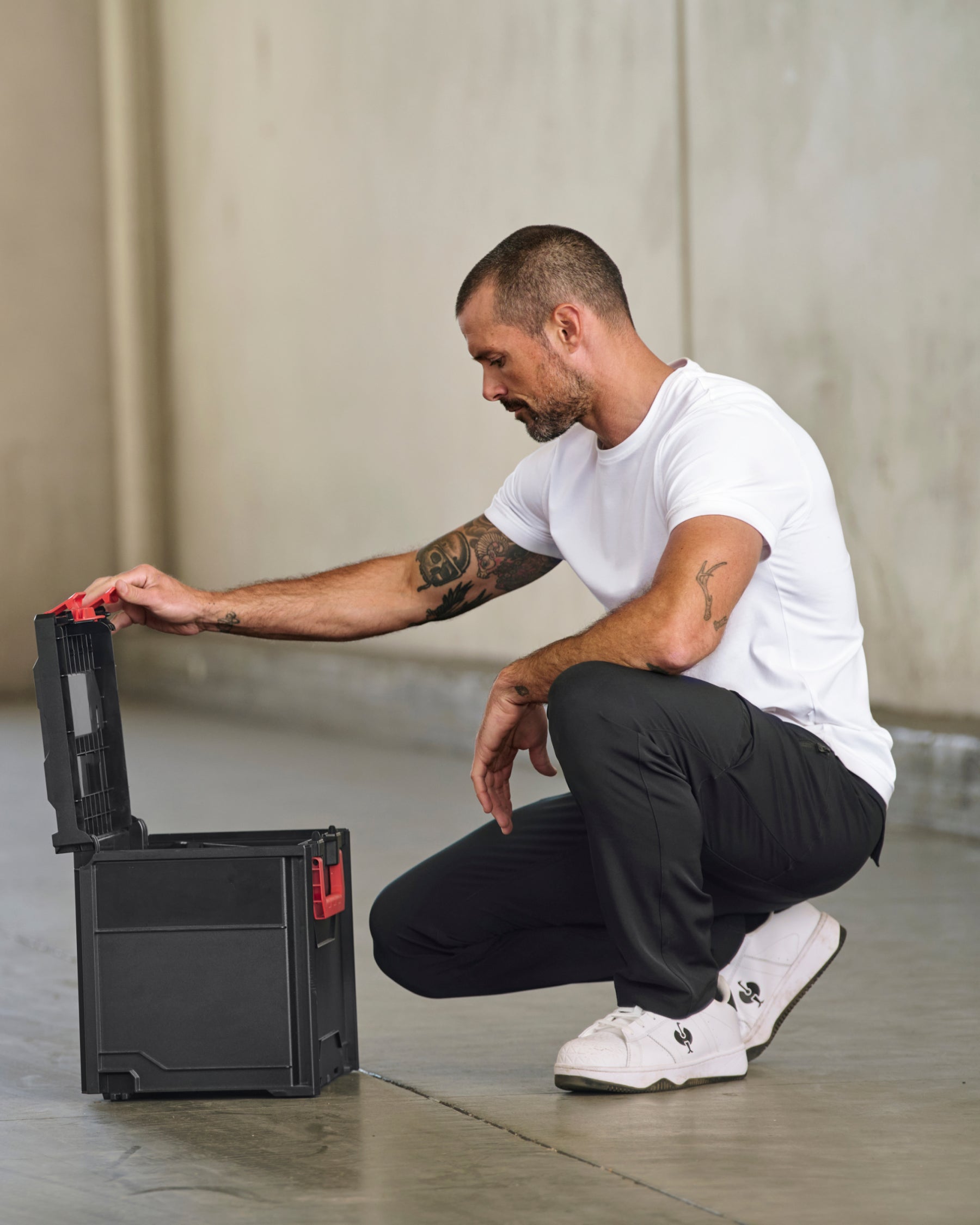 Utility Cargo Work Pants in black shown in an outdoor workwear setting