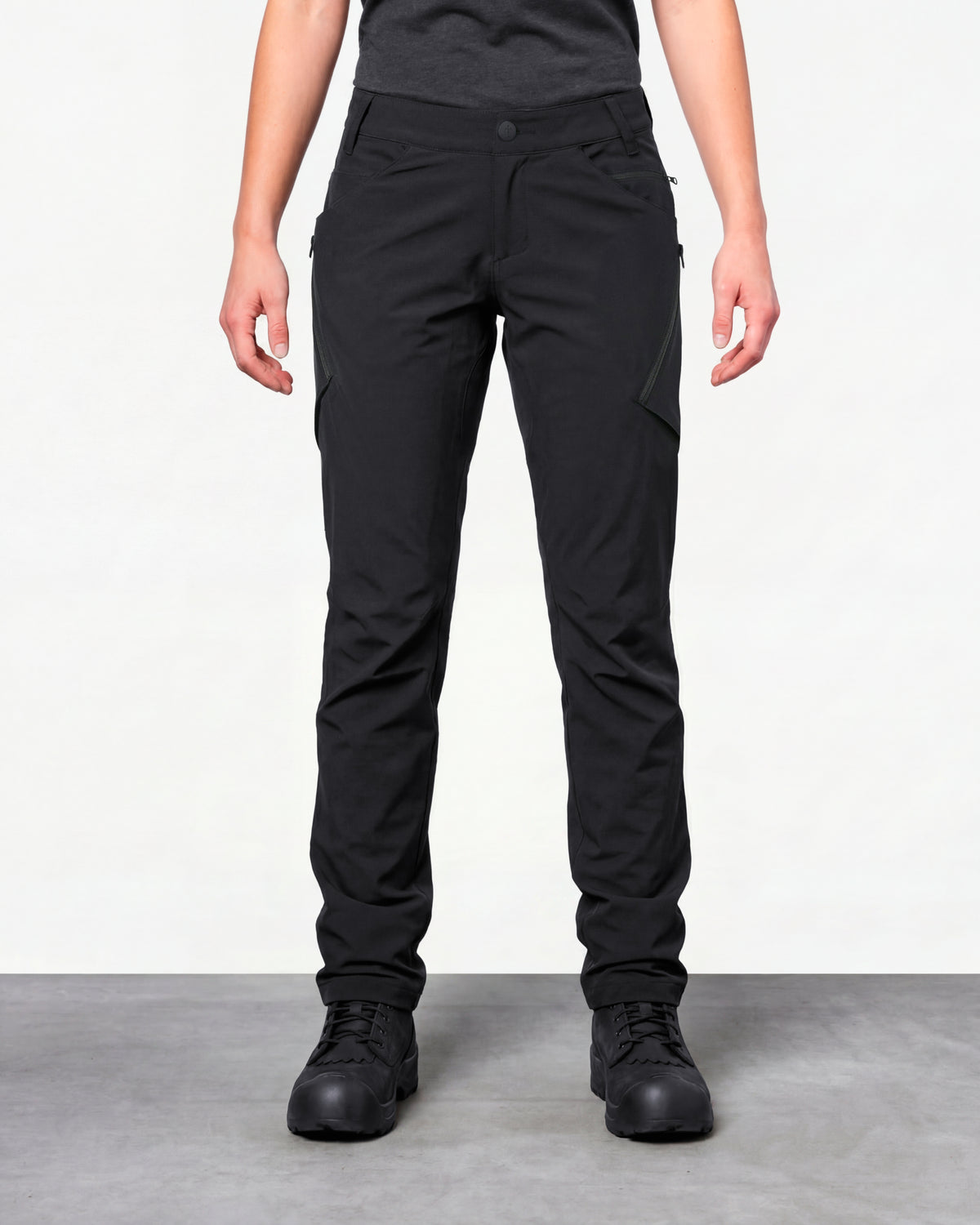 Women's Utility Cargo Work Pants in black worn by a model, front view