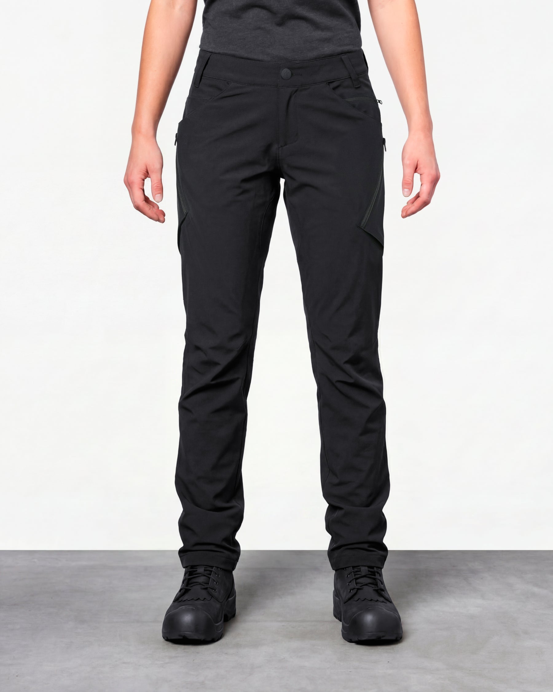 Women's Utility Cargo Work Pants in black worn by a model, front view