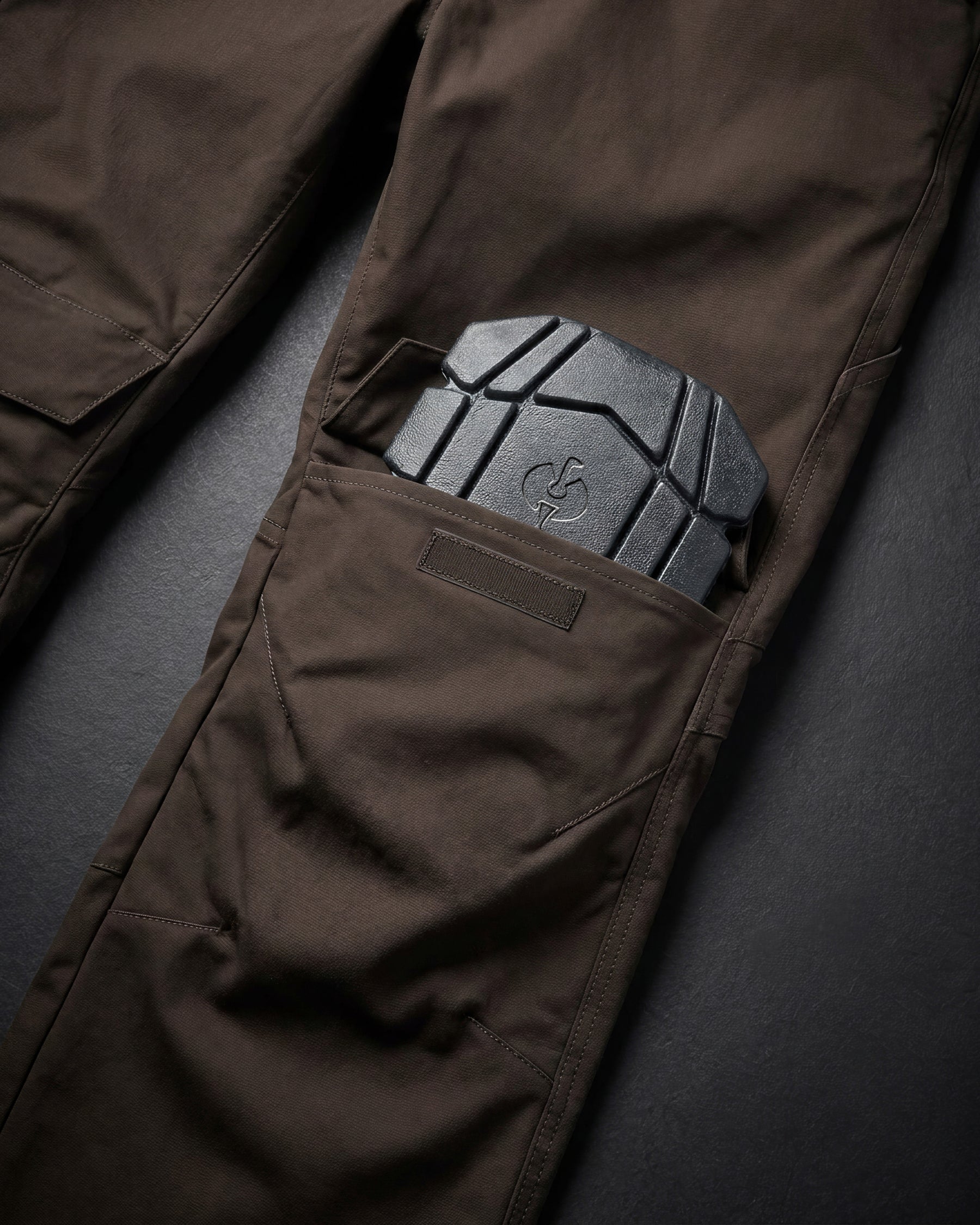 Close-up of knee pad pocket details on STRAUSS 1620 Worker Pants in moon gray