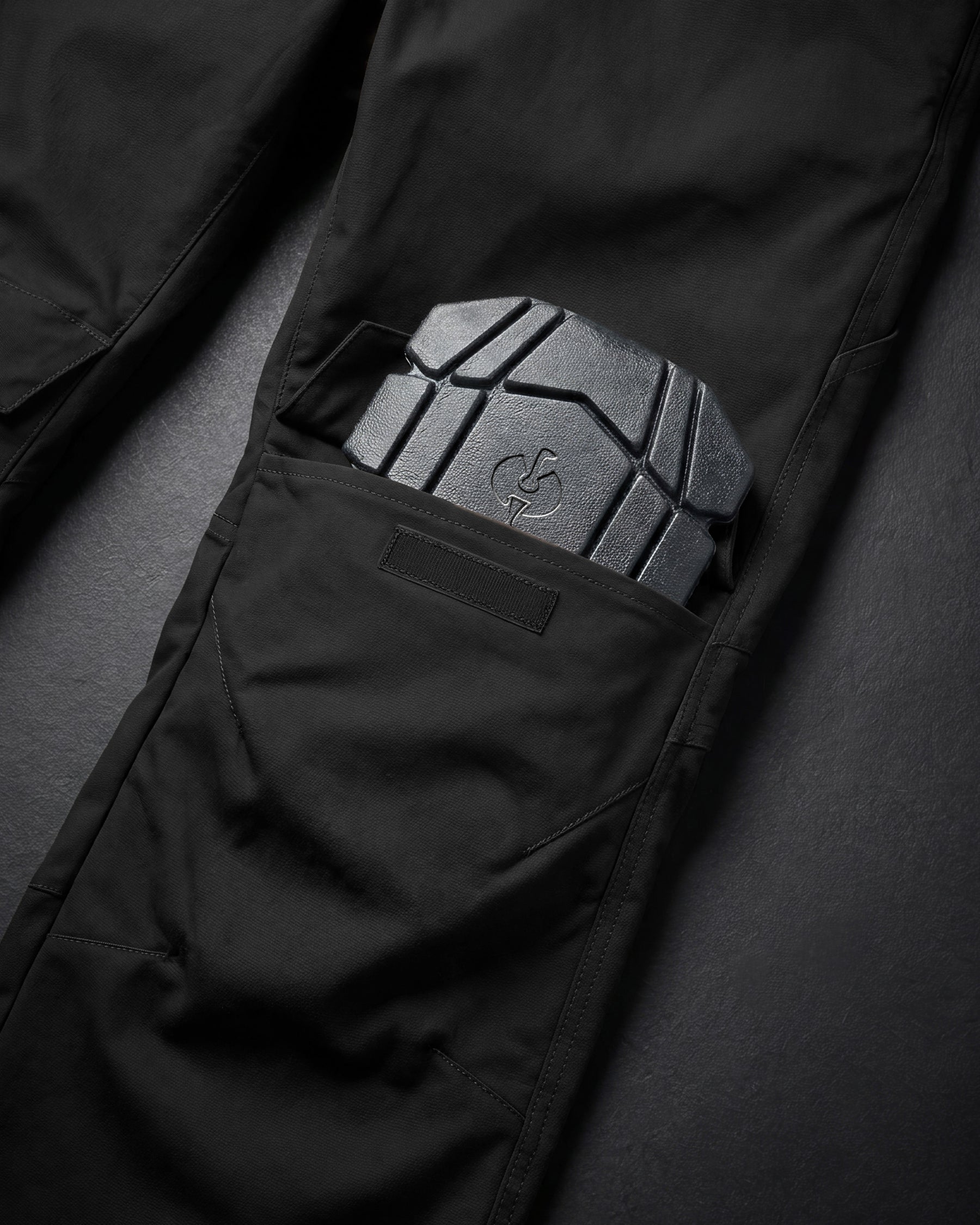Close-up of knee pad pocket details on STRAUSS 1620 Worker Pants in meteorite