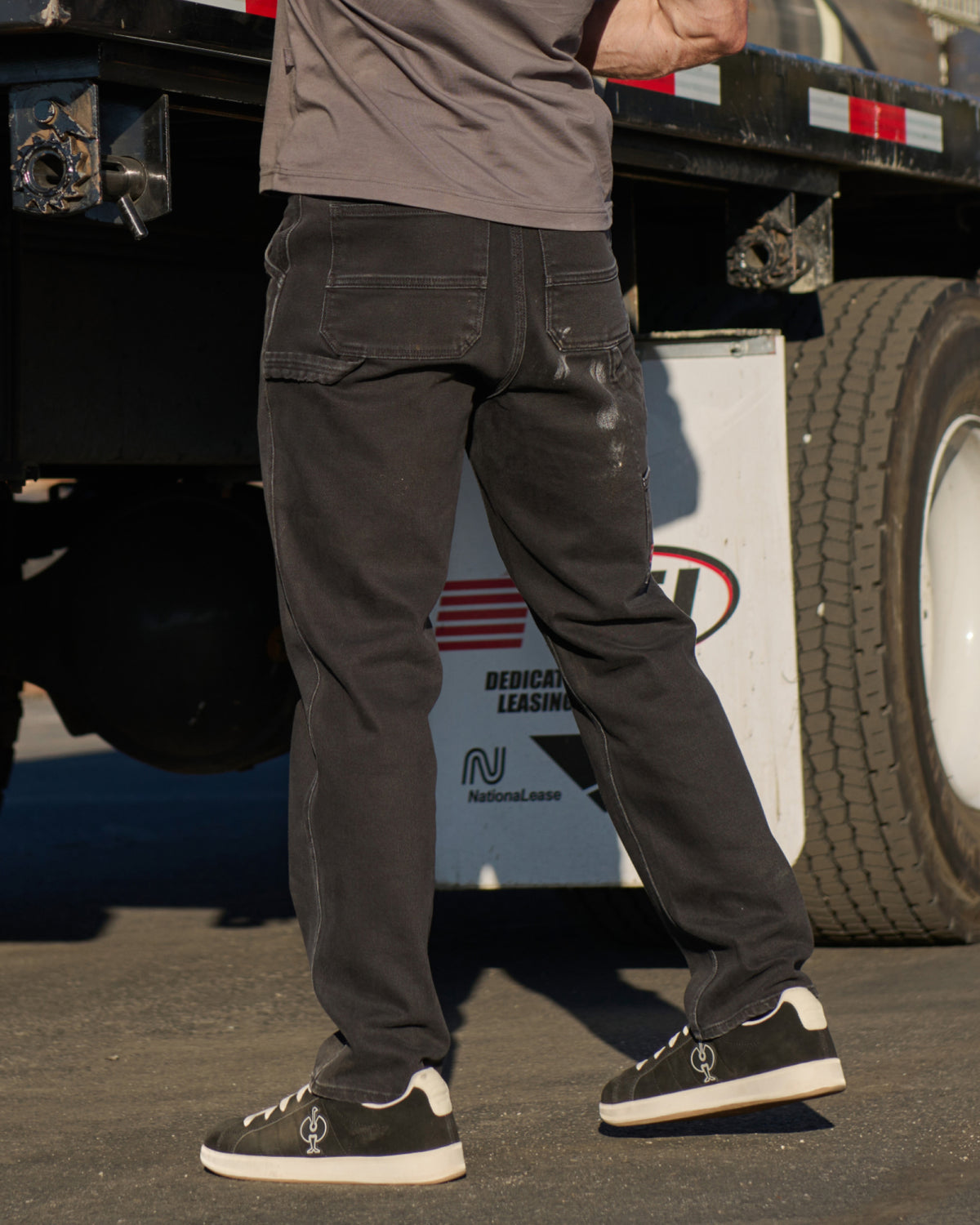 Carpenter Jeans e.s.iconic in black shown in an outdoor workwear setting
