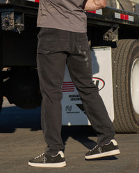 Carpenter Jeans e.s.iconic in black shown in an outdoor workwear setting
