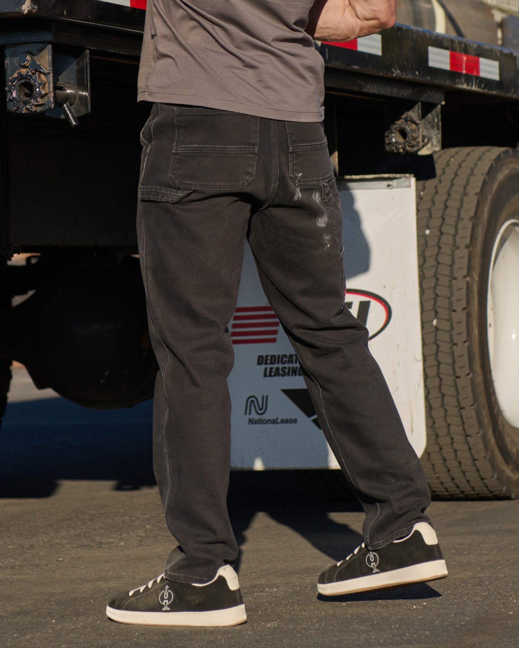 Carpenter Jeans e.s.iconic in black shown in an outdoor workwear setting