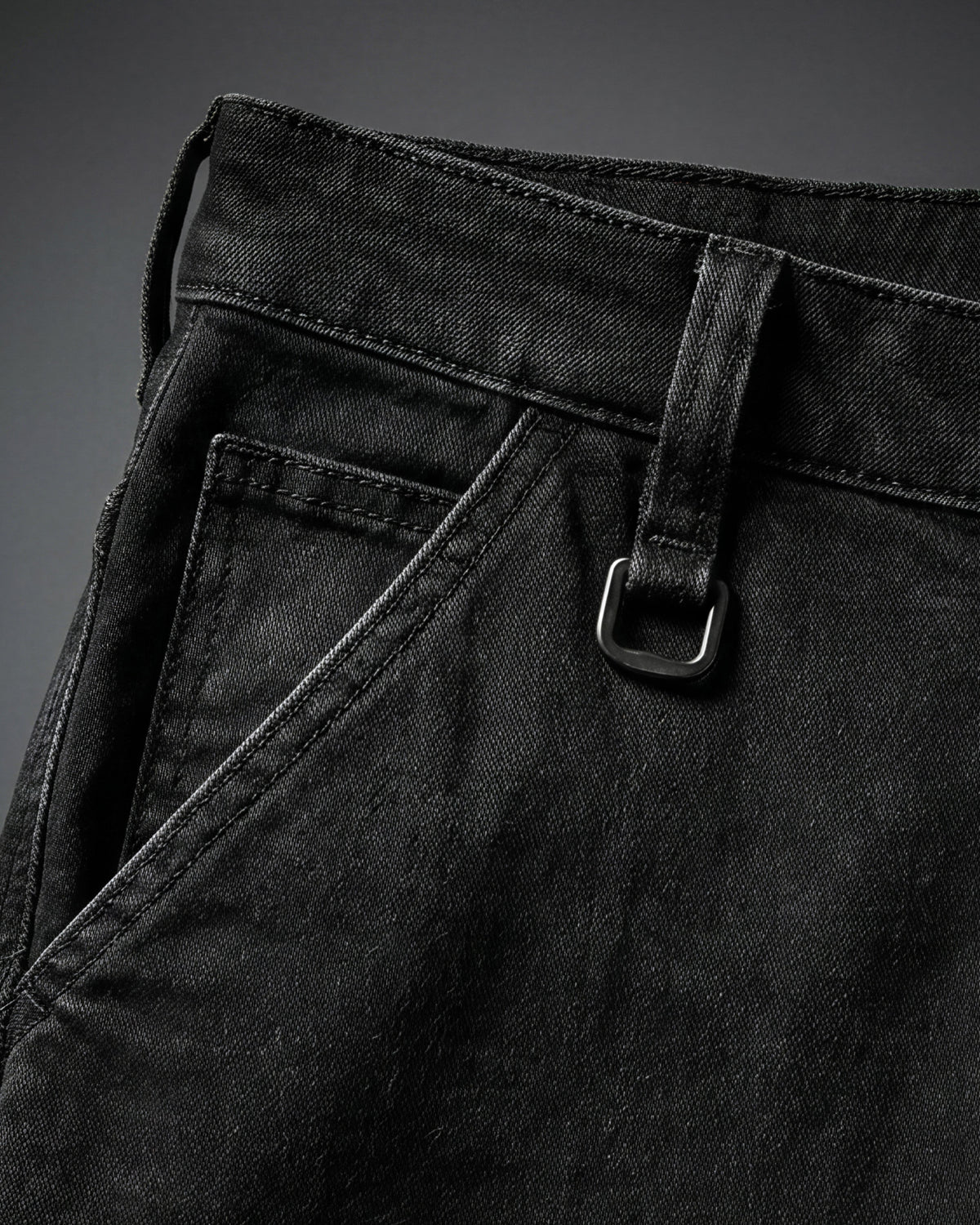 Close-up of denim workwear construction on Carpenter Jeans e.s.iconic in black