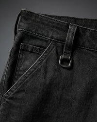 Close-up of denim workwear construction on Carpenter Jeans e.s.iconic in black