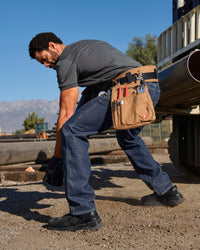 Carpenter Jeans e.s.iconic in dark wash shown in an outdoor workwear setting