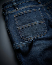 Close-up of denim pocket and stitching on Carpenter Jeans e.s.iconic in dark wash