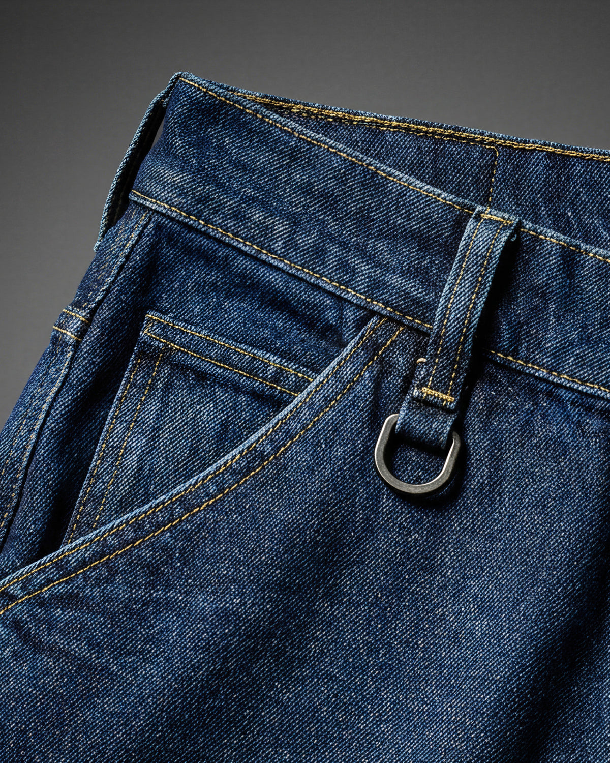 Close-up of denim workwear construction on Carpenter Jeans e.s.iconic in dark wash