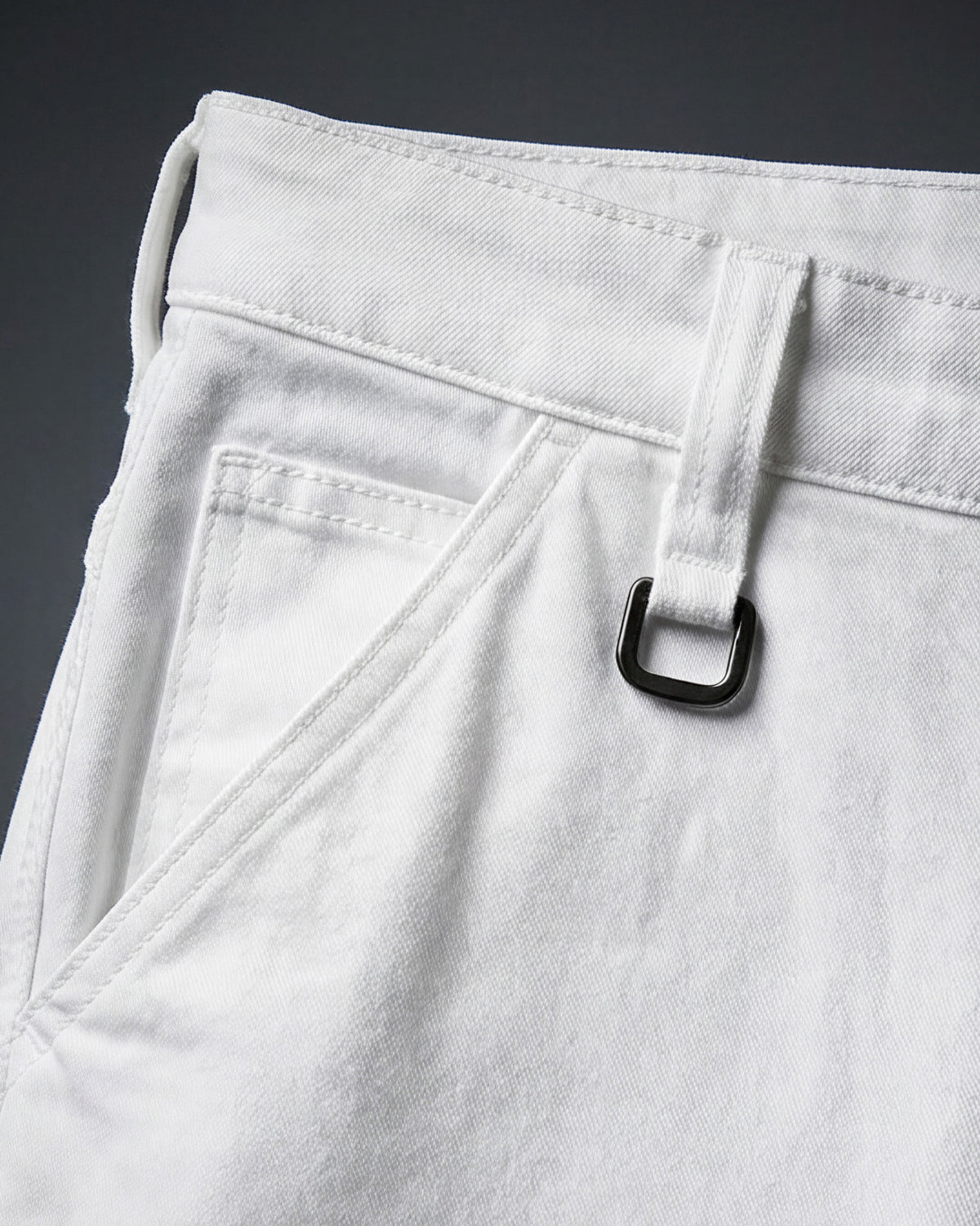 Close-up of denim workwear construction on Carpenter Jeans e.s.iconic in white