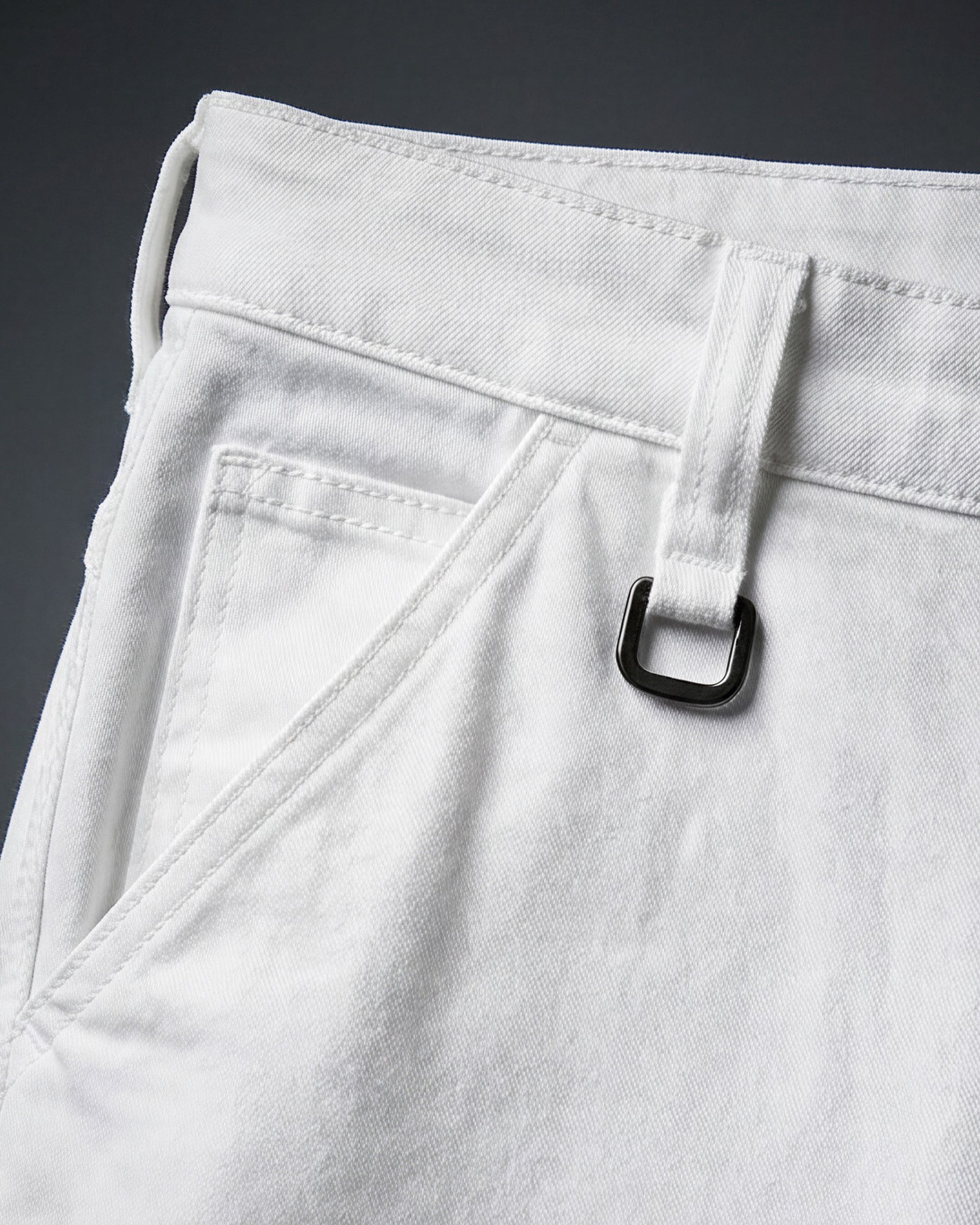 Close-up of denim workwear construction on Carpenter Jeans e.s.iconic in white