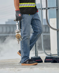 Power Denim 5-Pocket Jeans in stonewashed worn in a work setting