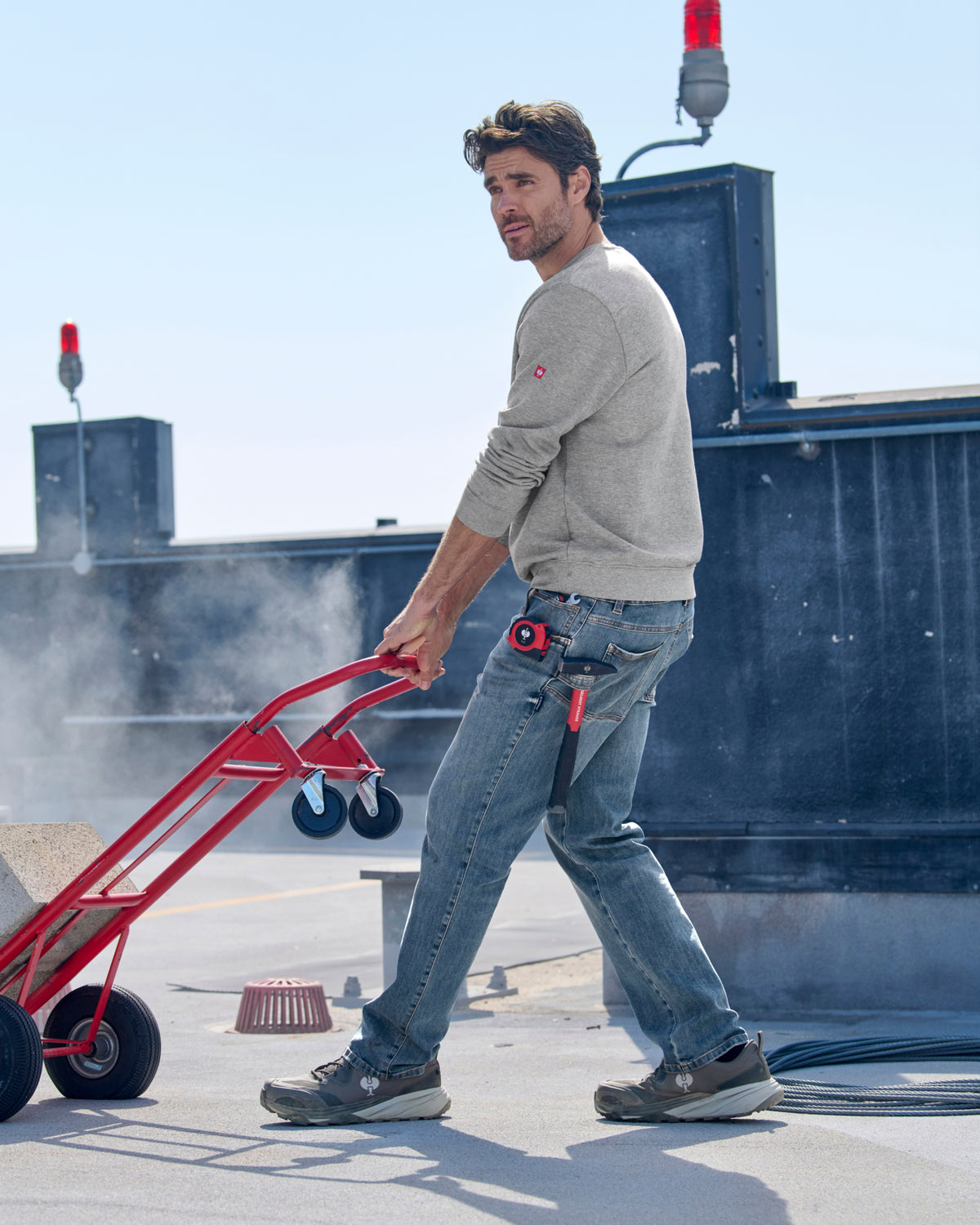Lifestyle view of Power Denim 5-Pocket Jeans in stonewashed during work
