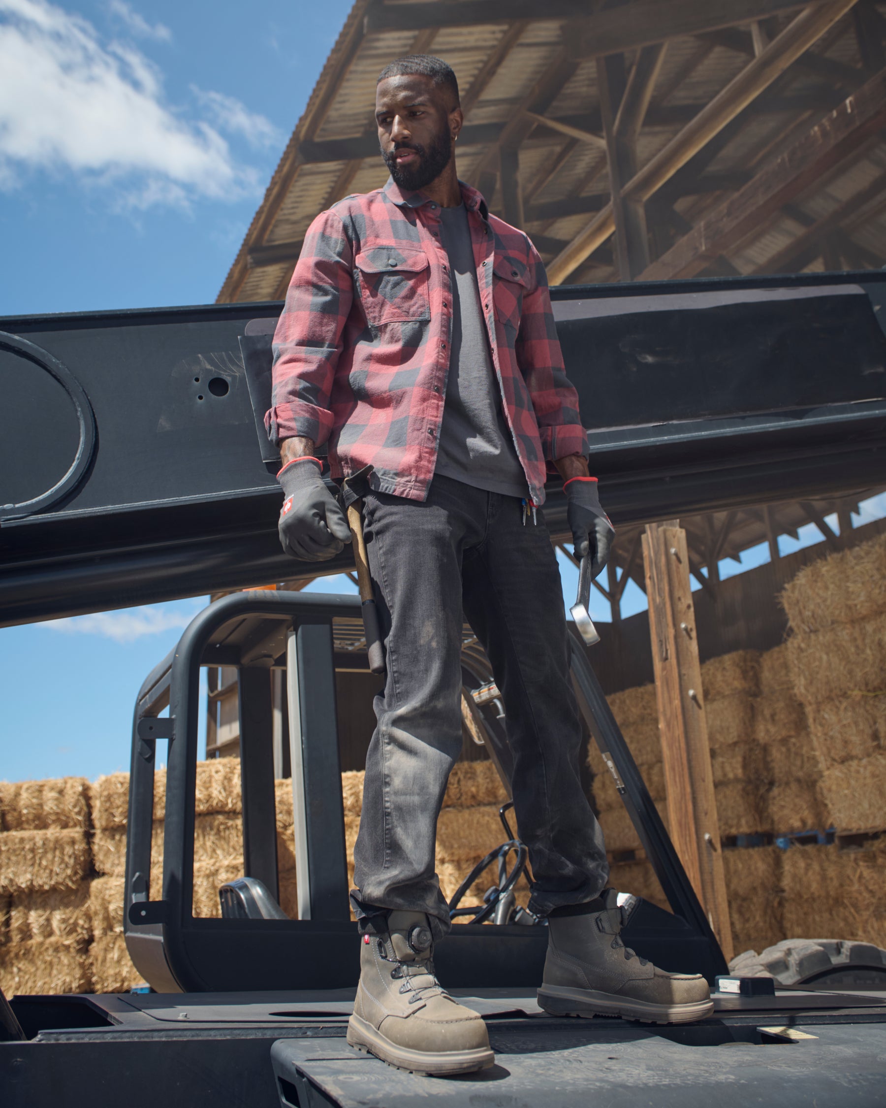 Lifestyle view of Power Denim 5-Pocket Jeans in blackwashed during work