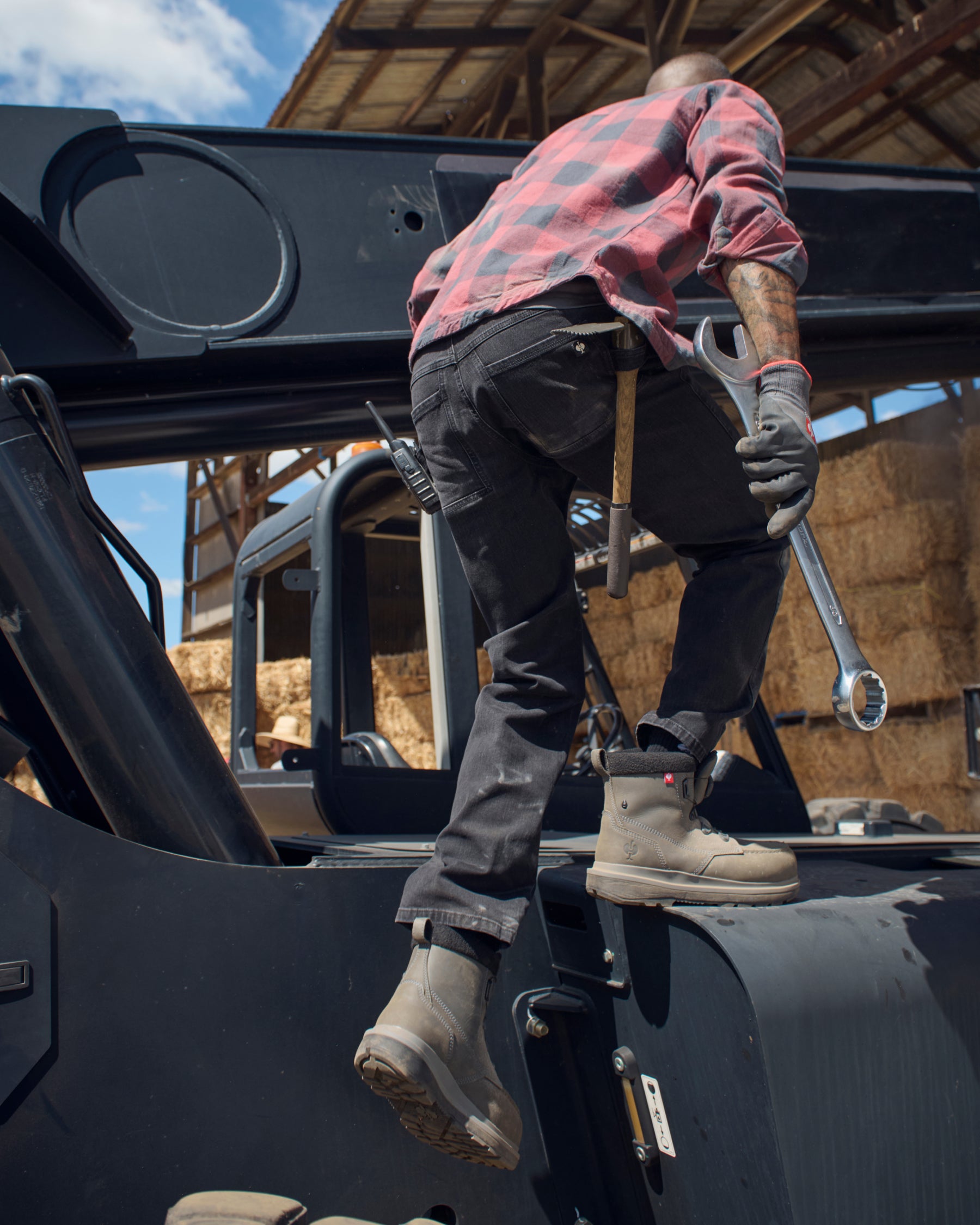 Power Denim 5-Pocket Jeans in blackwashed shown in an outdoor workwear setting