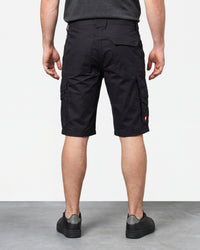 Alternate model view of Engelbert Strauss e.s. trail pure cargo work shorts in black and carbon gray, showing the side and back fit with visible utility pocket placement and workwear construction.