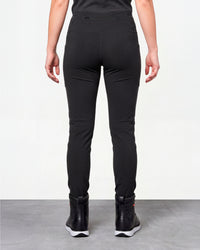 Women's Functional Leggings e.s.trail pure in black worn by a model, rear view